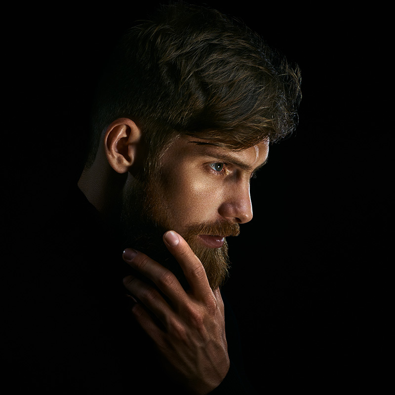 Hansome bearded man looking back.
